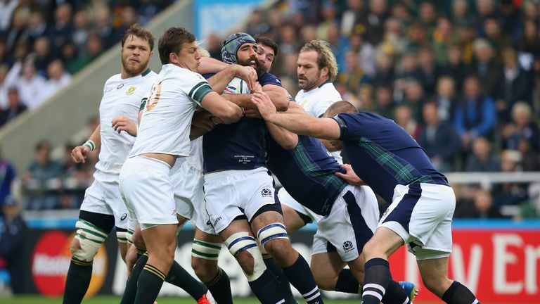 Josh Strauss is held up by Handre Pollard, Francois Louw and Schalk Burger