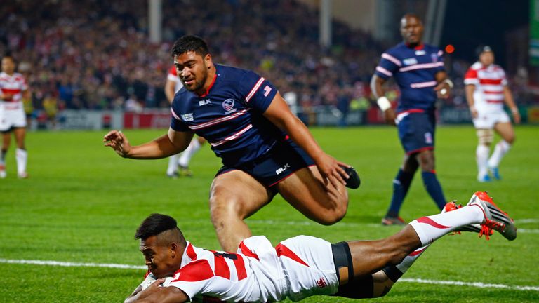 Kotaro Matsushima goes over to score Japan's first try