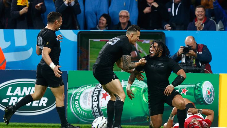 Ma'a Nonu (right) is congratulated by Sonny Bill Williams (middle) and Dan Carter after scoring New Zealand's seventh try against Tonga