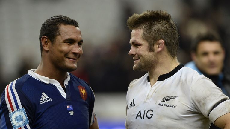 New Zealand captain Richie McCaw (right) chats with France captain Thierry Dusautoir after their Test match in Paris in 2013