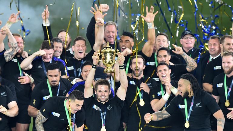 New Zealand captain Richie McCaw lifts the Webb Ellis Cup