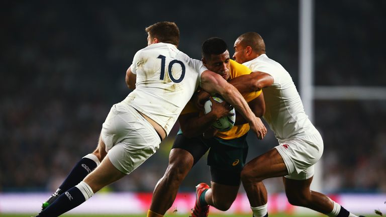 Australia prop Scott Sio is tackled by England duo Owen Farrell and Jonathan Joseph