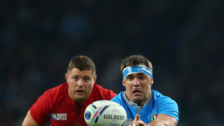 Italy flanker Simone Favaro passes from the ruck