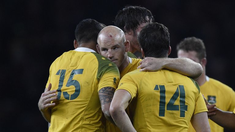 Australia's hooker Stephen Moore (middle) celebrates after their Pool A win over Wales