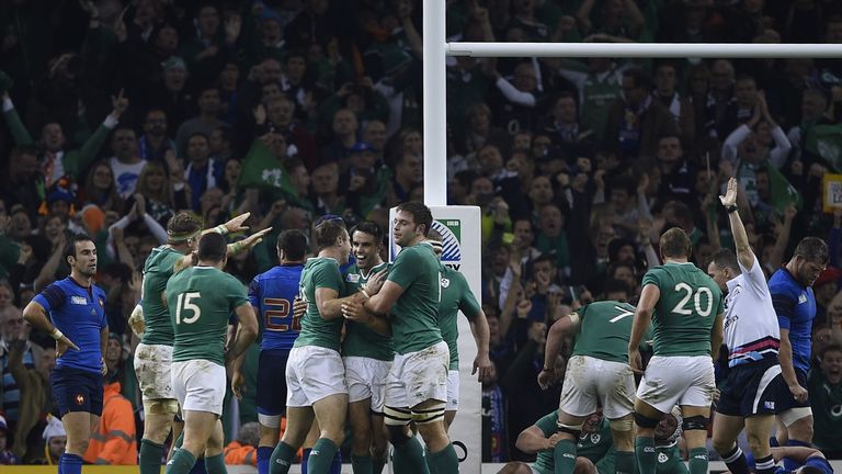 Irish scrum half Conor Murray (C) is congratulated by team-mates after scoring their second try against France at the Millennium Stadium