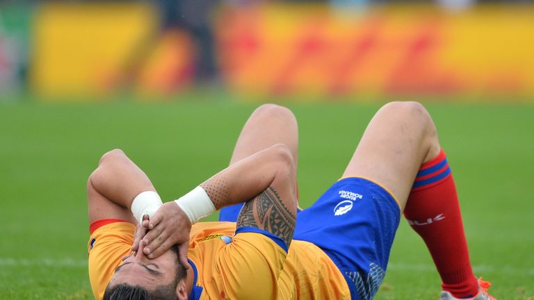 Romania's centre Florin Vlaicu lies down at the final whistle  of  a Pool D match of the 2015 Rugby World Cup between Italy and Romania at Sandy Park