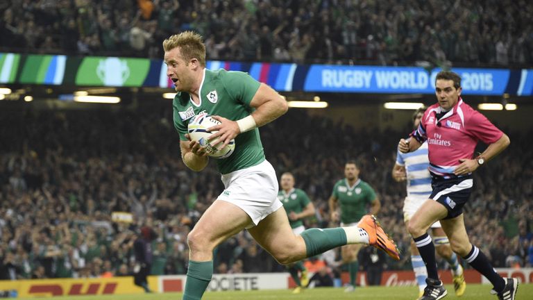 Luke Fitzgerald runs to score his team's first try  during a quarter final match between Ireland and Argentina at the Millennium Stadium