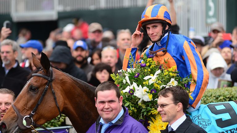 Ryan Moore celebrates after winning the Breeders' Cup Turf on Found