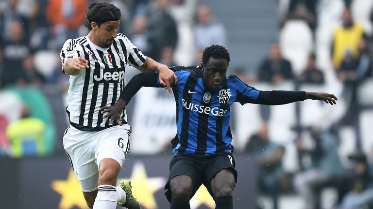 Juventus' midfielder Sami Khedira from fights for the ball with Atalanta's Boukary Drame
