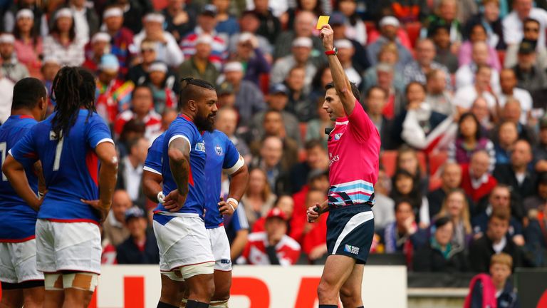 Referee Craig Joubert shows the yellow card to Faifili Levave of Samoa 