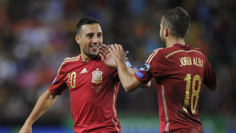 Santi Cazorla celebrates with Jordi Alba after scoring Spain's opening goal