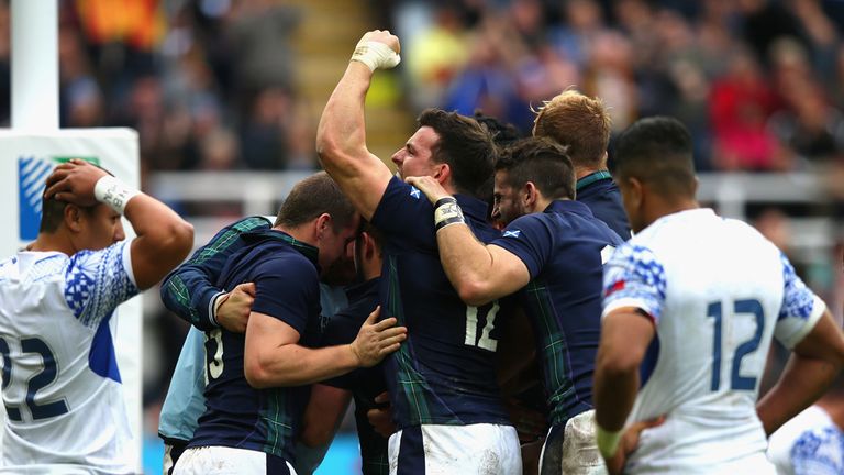 NEWCASTLE UPON TYNE, ENGLAND - OCTOBER 10:  The Scottish players celebrate after the third try during the 2015 Rugby World Cup Pool B match between Samoa a