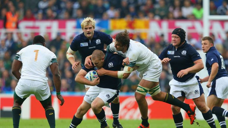 Scotland's  Gordon Reid is tackled during the World Cup match against South Africa
