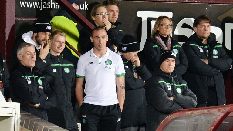 Celtic captain Scott Brown watches on after injuring himself in the warm-up
