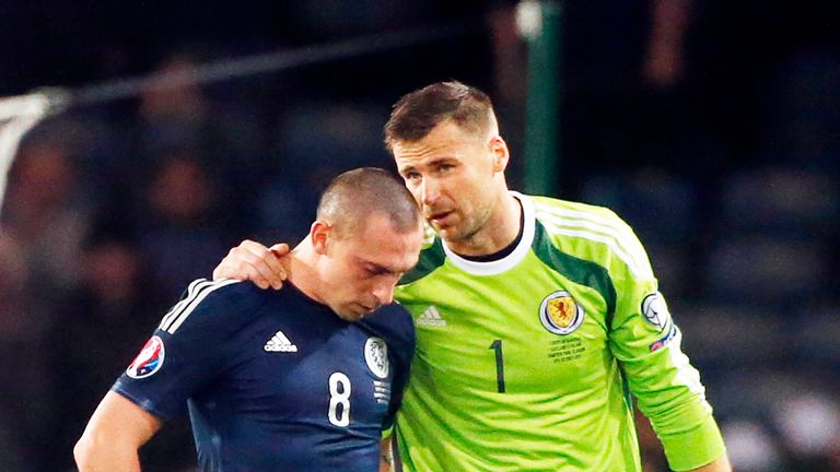 Scotland's Scott Brown (left) and goalkeeper David Marshall appear dejected after the UEFA European Championship Qualifying match v Poland at Hampden Park