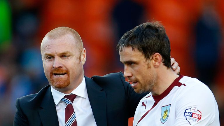 Manager Sean Dyche (L) of Burnley congratulates player Michael Duff 