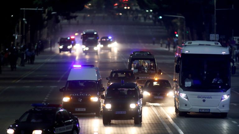 The Serbia coach is escorted through Tirana