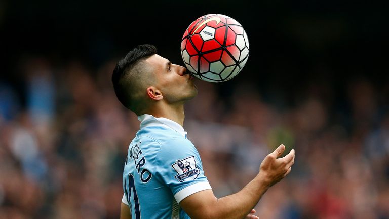Sergio Aguero of Manchester City kisses the ball to celebrate his goal blitz against Newcastle