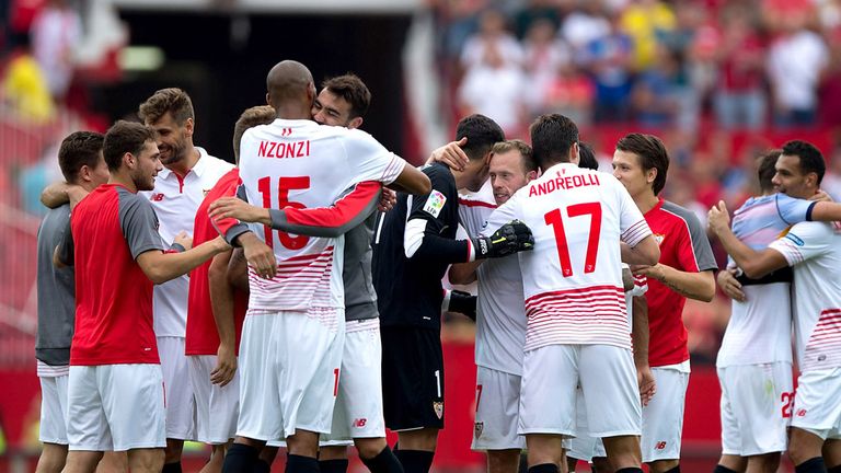 Sevilla FC players celebrate their victory over Barcelona