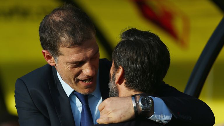 Slaven Bilic and Quique Sanchez Flores share a hug