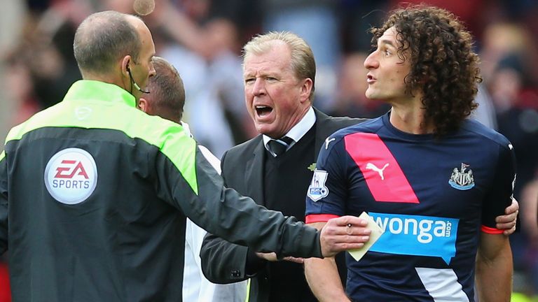 Fabricio Coloccini of Newcastle leaves the pitch after being sent off while Steve McClaren looks on