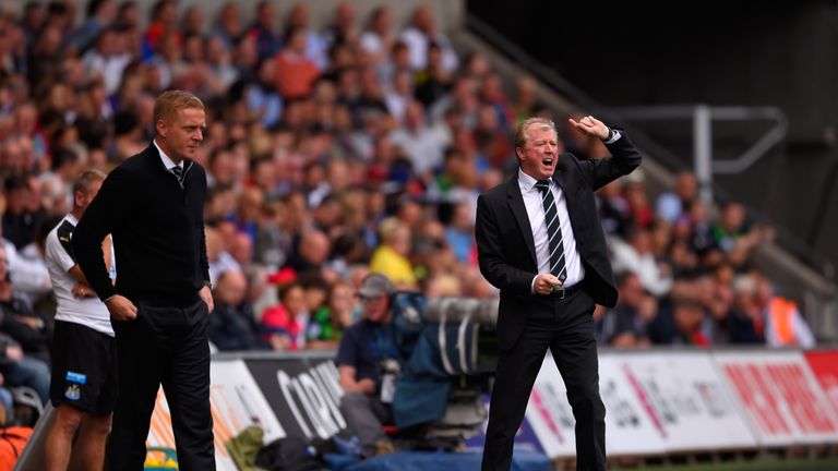 Steve McLaren, manager of Newcastle United, (right) and Garry Monk Manager of Swansea City look on during the match between their sides.