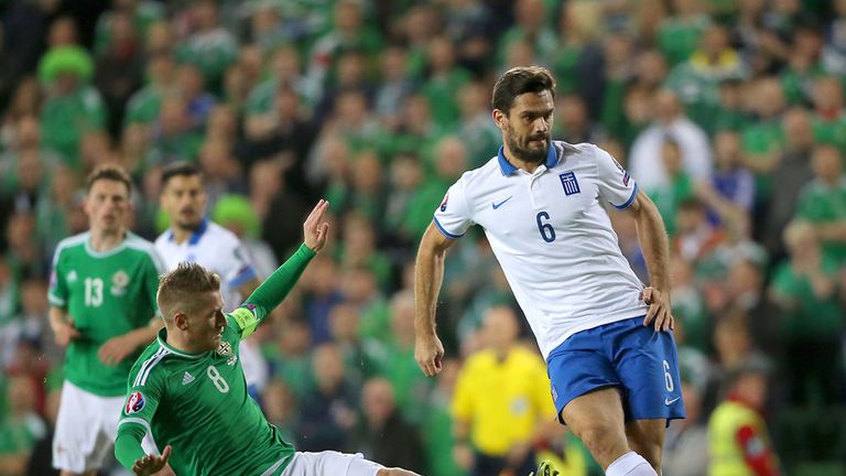 Steven Davis tackles Alexandros Tziolis 