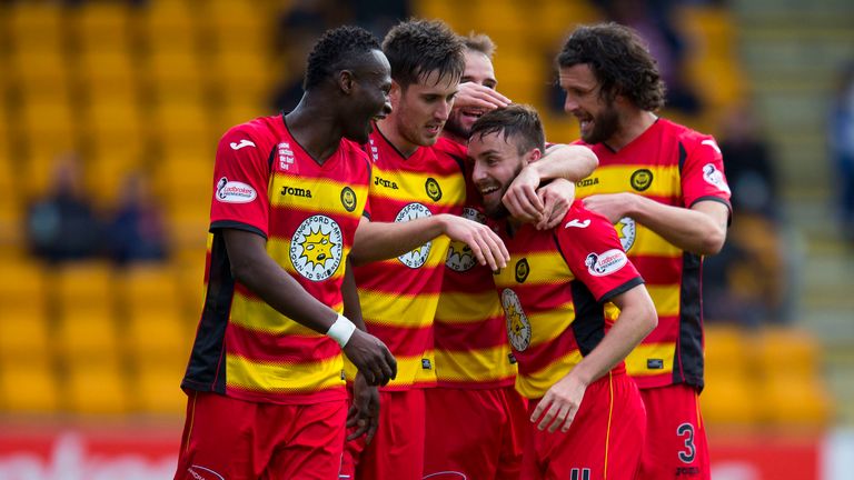 Steven Lawless (2nd right) celebrates his goal for Partick with team-mates.