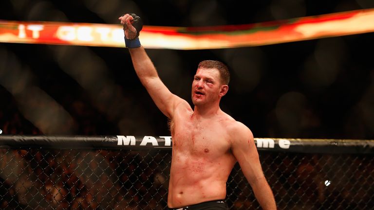 Stipe Miocic reacts in the octagon