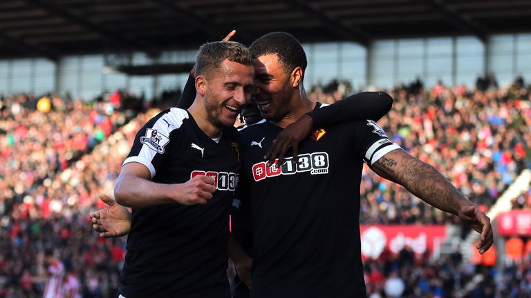 Alman Abdi of Watford celebrates scoring his side's second goal with team-mate Troy Deeney during the Barclays Premie