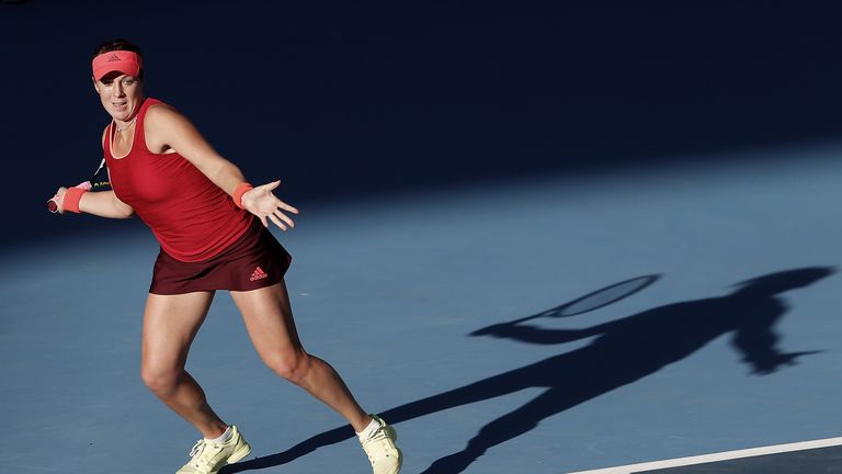 Anastasia Pavlyuchenkova of Russia returns a shot against Flavia Penneta of Italy