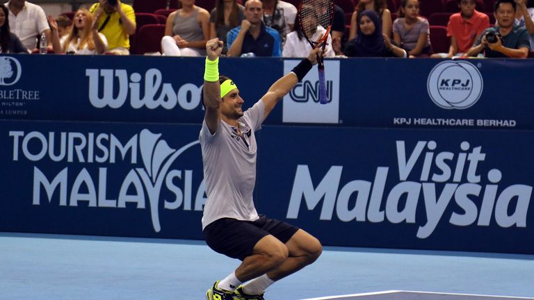 David Ferrer celebrates after defeating Feliciano Lopez of in the 2015 Malaysian Open final
