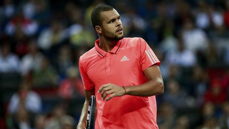 Jo-Wilfried Tsonga of France reacts after losing the point against Novak Djokovic of Serbia during the men's singles final