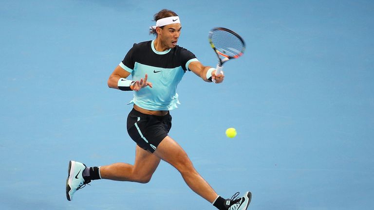 Rafa Nadal plays a forehand in his match against Vasek Pospisil at the 2015 China Open