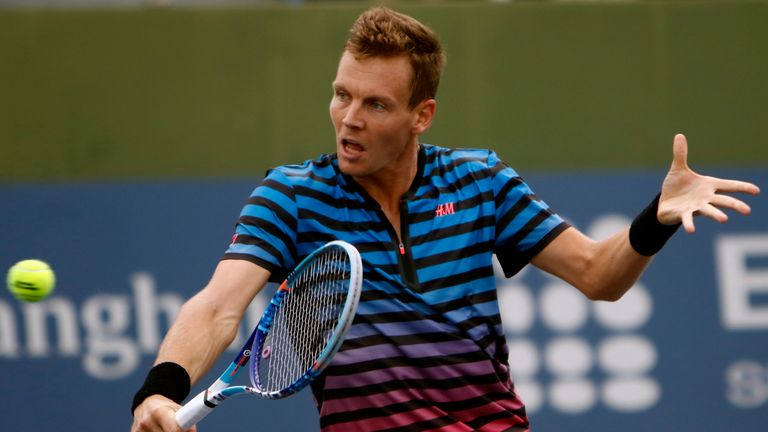 Tomas Berdych of Czech Republic returns a shot against Jack Sock of United States