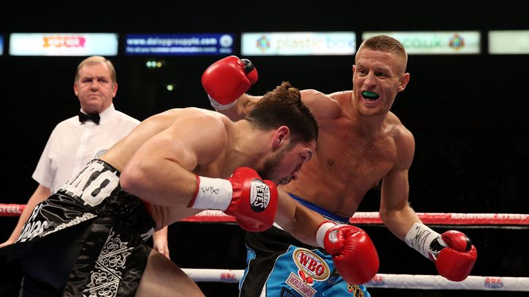 MANCHESTER, ENGLAND - OCTOBER 10:  Terry Flanagan of Great Britain (R) and Diego Magdaleno of the USA exchange blows in their WBO World Lightweight Champio