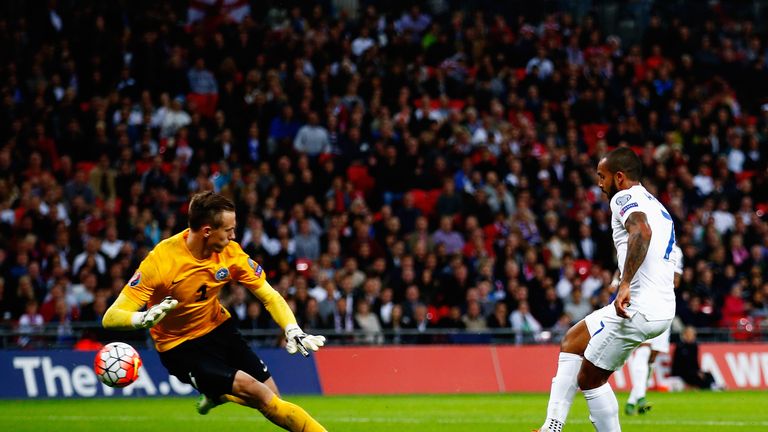 Theo Walcott opens the scoring for England on the stroke of half-time