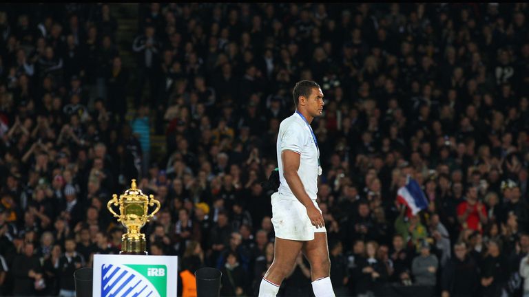 Thierry Dusautoir walks past the William Webb Ellis trophy on his way to collecting his runner-up medal after the 2011 final