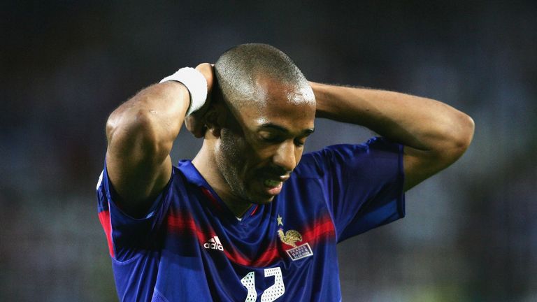 Thierry Henry of France holds his head during the UEFA Euro 2004 Quarter Final defeat to Greece.