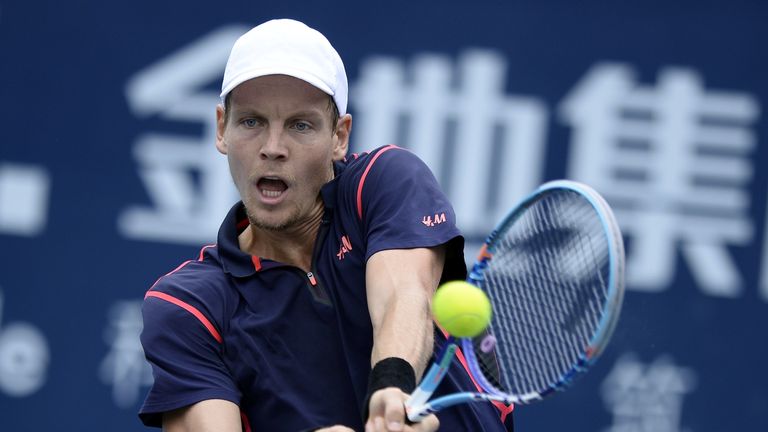 Tomas Berdych of the Czech Republic hits a return against Guillermo Garcia-Lopez