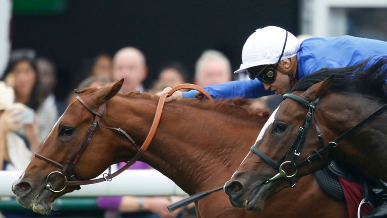 Mickael Barzalona riding Ultra (L) win The Qatar Prix Jean-Luc Lagarders at Longchamp racecourse on October 04, 2015 in Paris