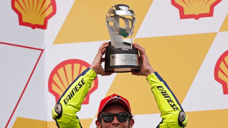 Valentino Rossi with his trophy for finishing third at the Malaysian Grand Prix