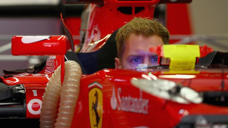 Sebastian Vettel of Germany and Ferrari sits in his car in the garage during previews to the Formula One Grand Prix of Russia 