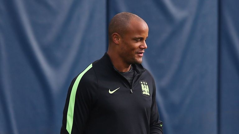 MANCHESTER, ENGLAND - OCTOBER 20:  Vincent Kompany and Kevin De Bruyne of Manchester City talk during a training session at the City Football Academy on Oc