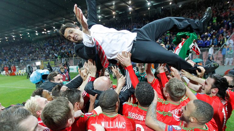 Wales players carry Chris Coleman aloft after securing qualification to Euro 2016.