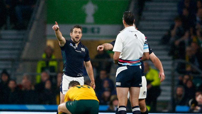 LONDON, ENGLAND - OCTOBER 18: Greig Laidlaw of Scotland talks to referee Craig Joubert after he awarded Australia a late penalty during the 2015 Rugby Worl