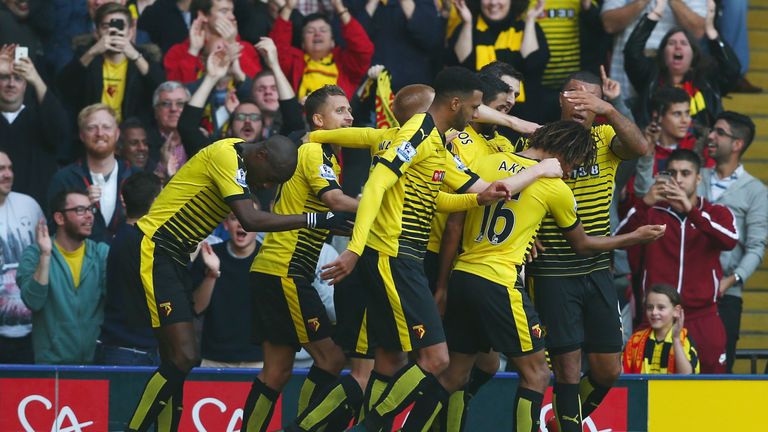 Watford players celebrate Odion Ighalo (obscured) after the Nigerian gave the Hornets a 1-0 advantage against West Ham