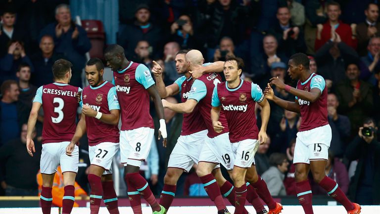 Andy Carroll of West Ham celebrates scoring his team's second goal with his team mates during the Premier League match between West Ham United and Chelsea