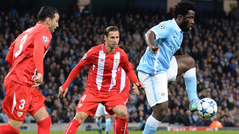 Wilfried Bony controls the ball next to Sevilla's defender Adil Rami (left) and Grzegorz Krychowiak (centre) 