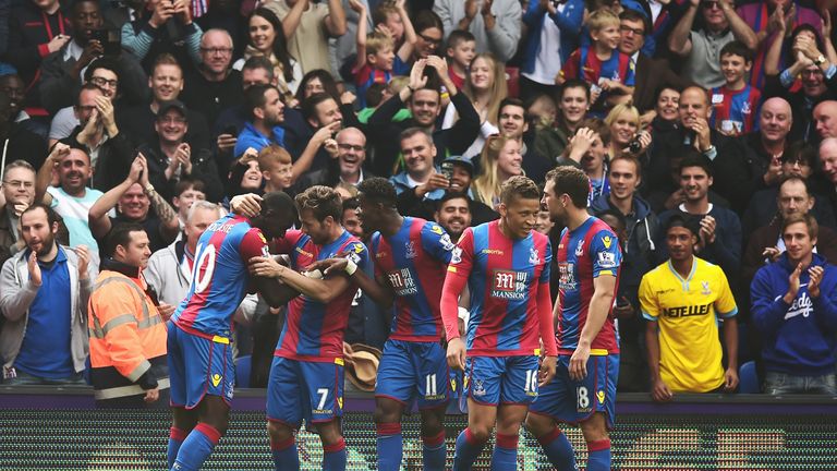 Yannick Bolasie (1st L) celebrates with team-mates after breaking the deadlock at Selhurst Park
